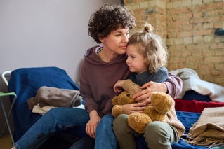 homeless family on bed